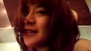 Japanese chick shows off her natural tits