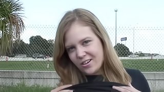 Gorgeous teen fingering her tight pussy in a raunchy outdoors clip