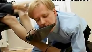 Beautiful boss at work makes him lick her high heels