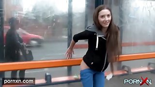 Beautiful girl has fun playing in public