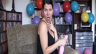 Hot woman blows air in balloon to grow bigger