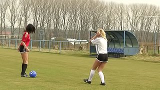 Soccer chicks in the grass finger fuck each other