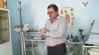 Mature Olga has her redhead pussy gyno speculum examined