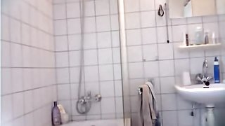 Tan lined ass and hairy cunt of hidden shower cam bimbo