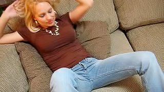 Jeans-clad blonde with a stunning body touching her hot ass