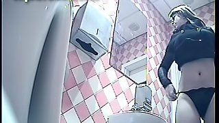 Slender busty blonde is peeing on the video