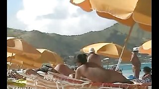 Beach voyeur video of a nude milf and a nude Asian hottie