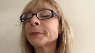 Big boobed blonde milf in stockings and a garter