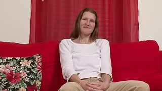 Mature woman with a shaved cunt wants to play with a dildo