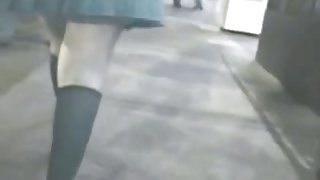 Curvy babe in knee high stockings caught by an upskirt cam