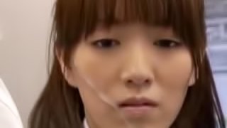 Japanese girl shows her tits and gets face-fucked in a crowded bus