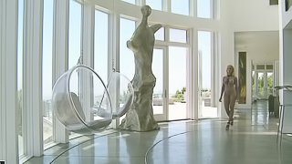 A kinky blonde bitch in a purple fishnet outfit playing