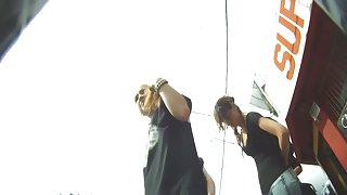 Blonde cutie treats us to an up skirt view of her ass