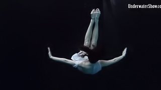Solo model  brunette with long hair shading attire in the pool