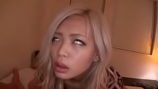 Sexy Asian chick with long blonde hair enjoying a hardcore missionary style fuck