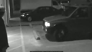 Babe is on knees sucking cock in the parking place in voyeur xxx