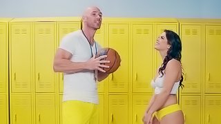 A girl is in the locker room and she is giving a blow job to a guy