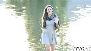 Longhaired hottie is inserting banana in her luscious snatch