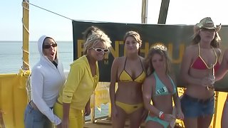 Some slutty girls flash their tits and butts at an outdoor party